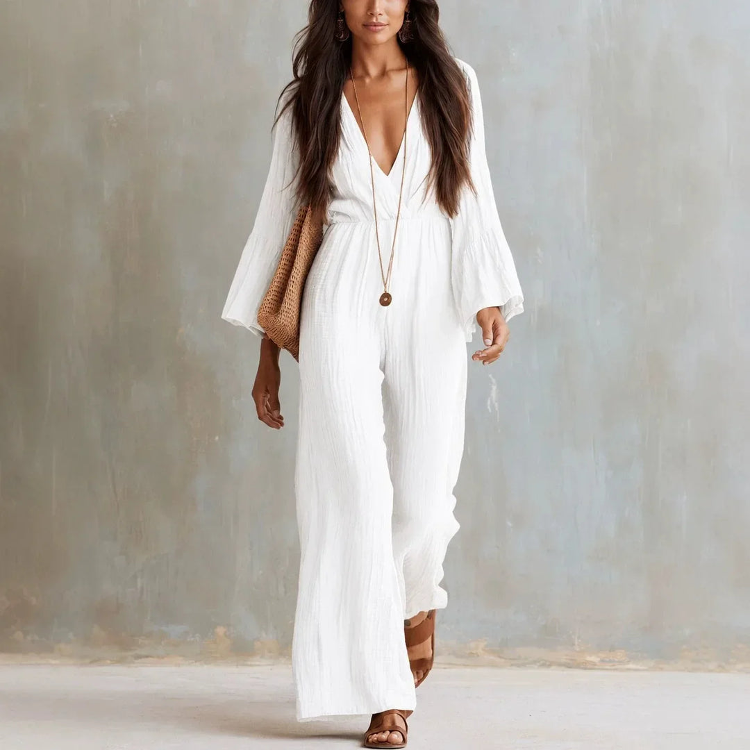 Women's boho wide leg jumpsuit with deep V-neck and flare sleeves, perfect for summer vacation or chic events.