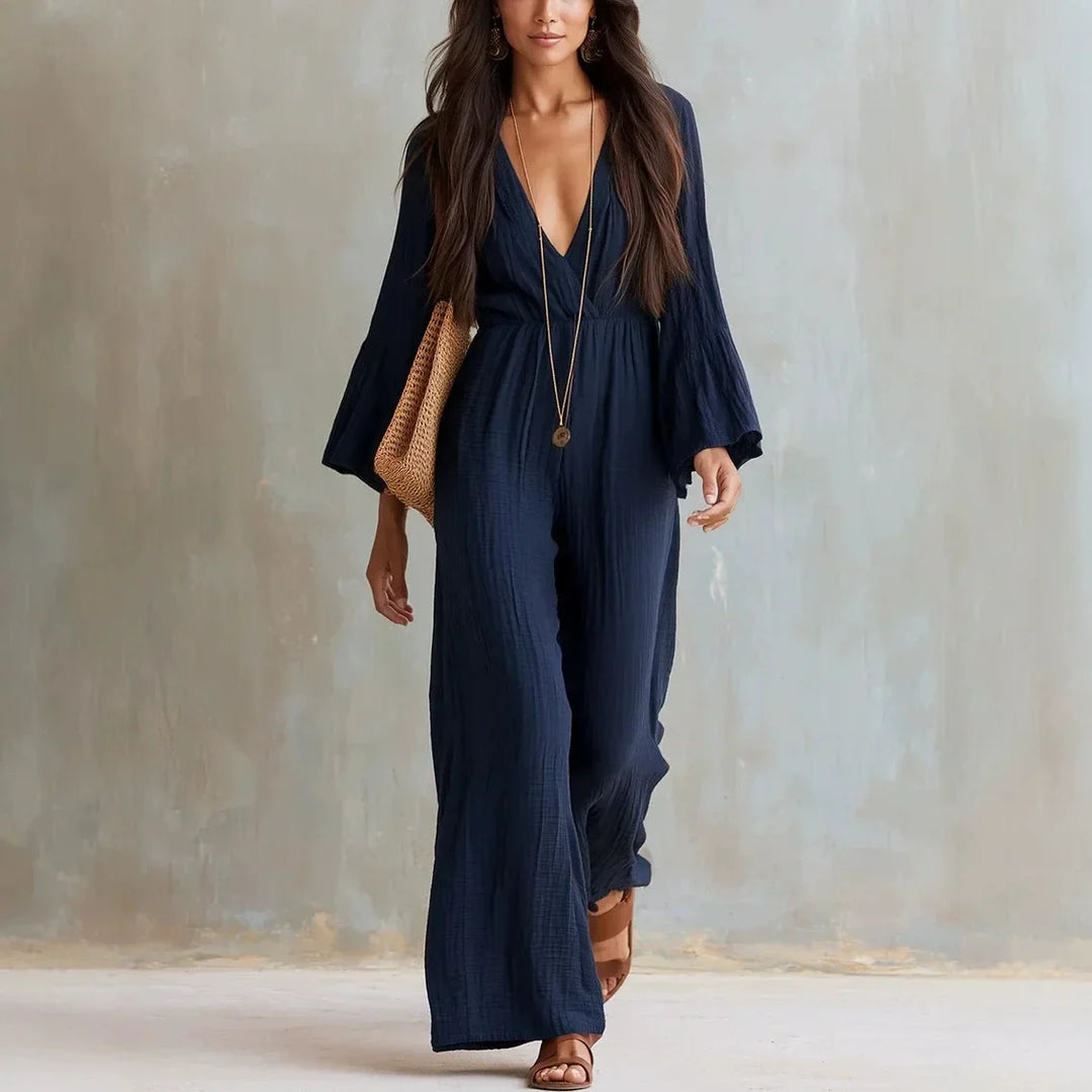 Elegant women's boho wide leg jumpsuit, featuring a deep V-neck and stylish flare sleeves, for effortless summer fashion.