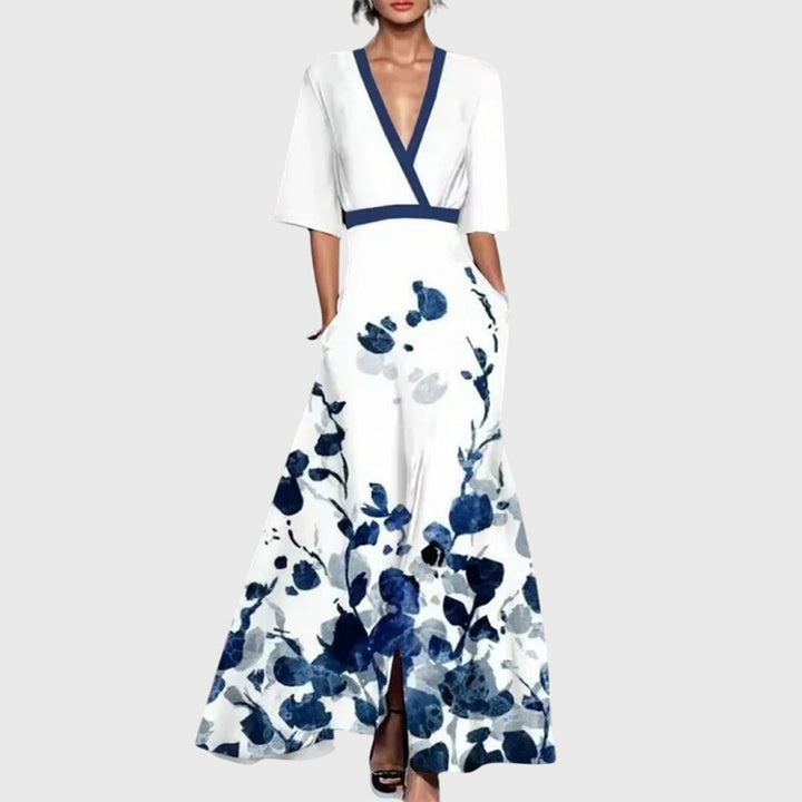 Women's bold floral maxi dress with deep V-neck and elegant contrast trim. Flowy summer party dress with pockets.