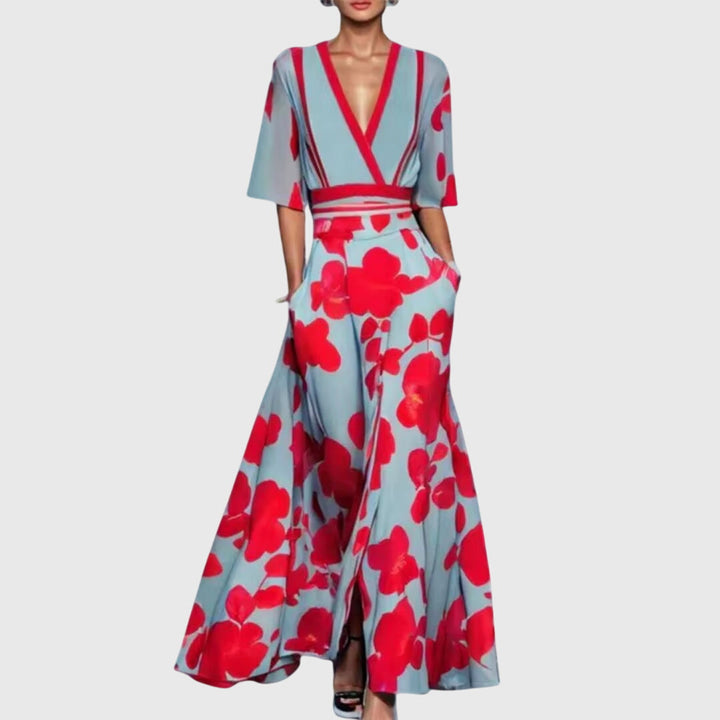 Vibrant women's bold floral flowy maxi dress. Features a deep V-neck, stylish contrast trim, and comfortable pockets.