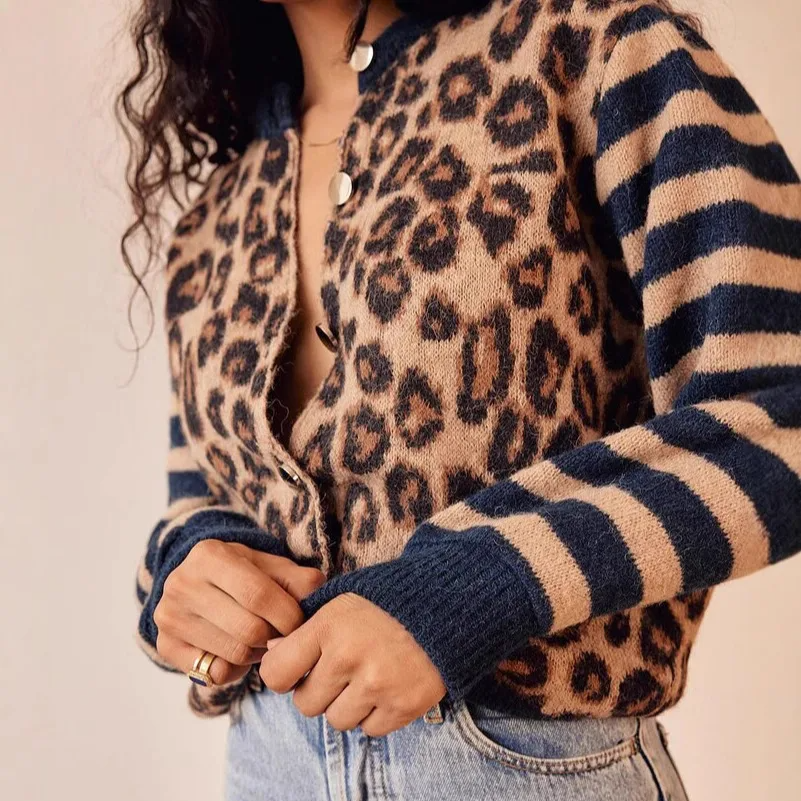 Vintage-inspired women's leopard print cardigan, a cozy knit with long striped sleeves, ideal for fall style.
