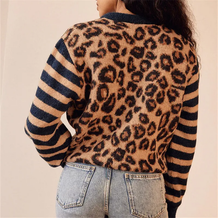 Chic animal print women's cardigan, long sleeve knit with button front and contrasting black and white striped details.