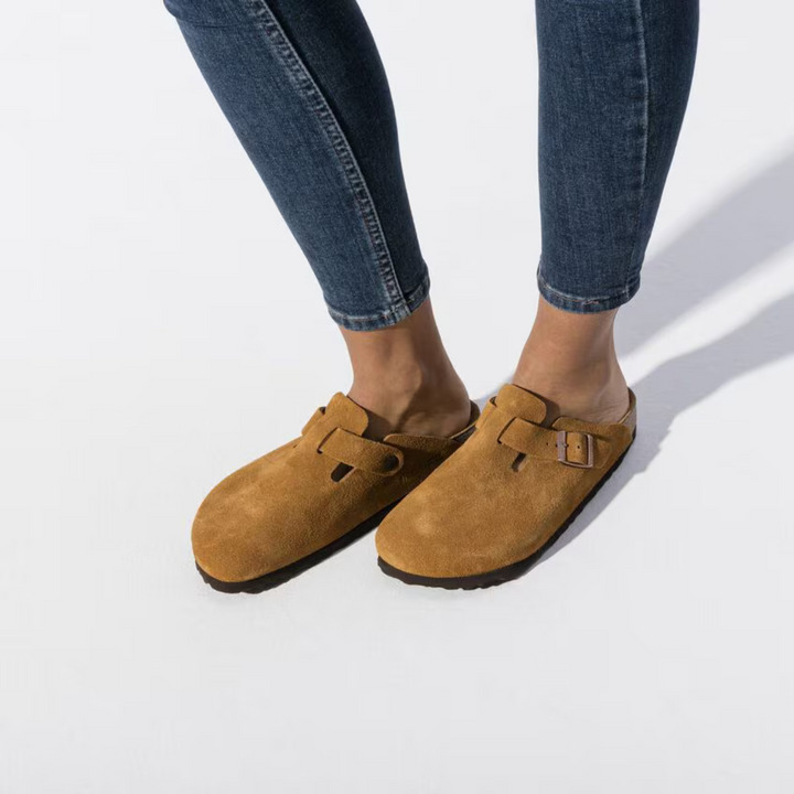 Detailed shot of the cushioned anatomical footbed inside Women's Boston clogs, providing superior arch support.