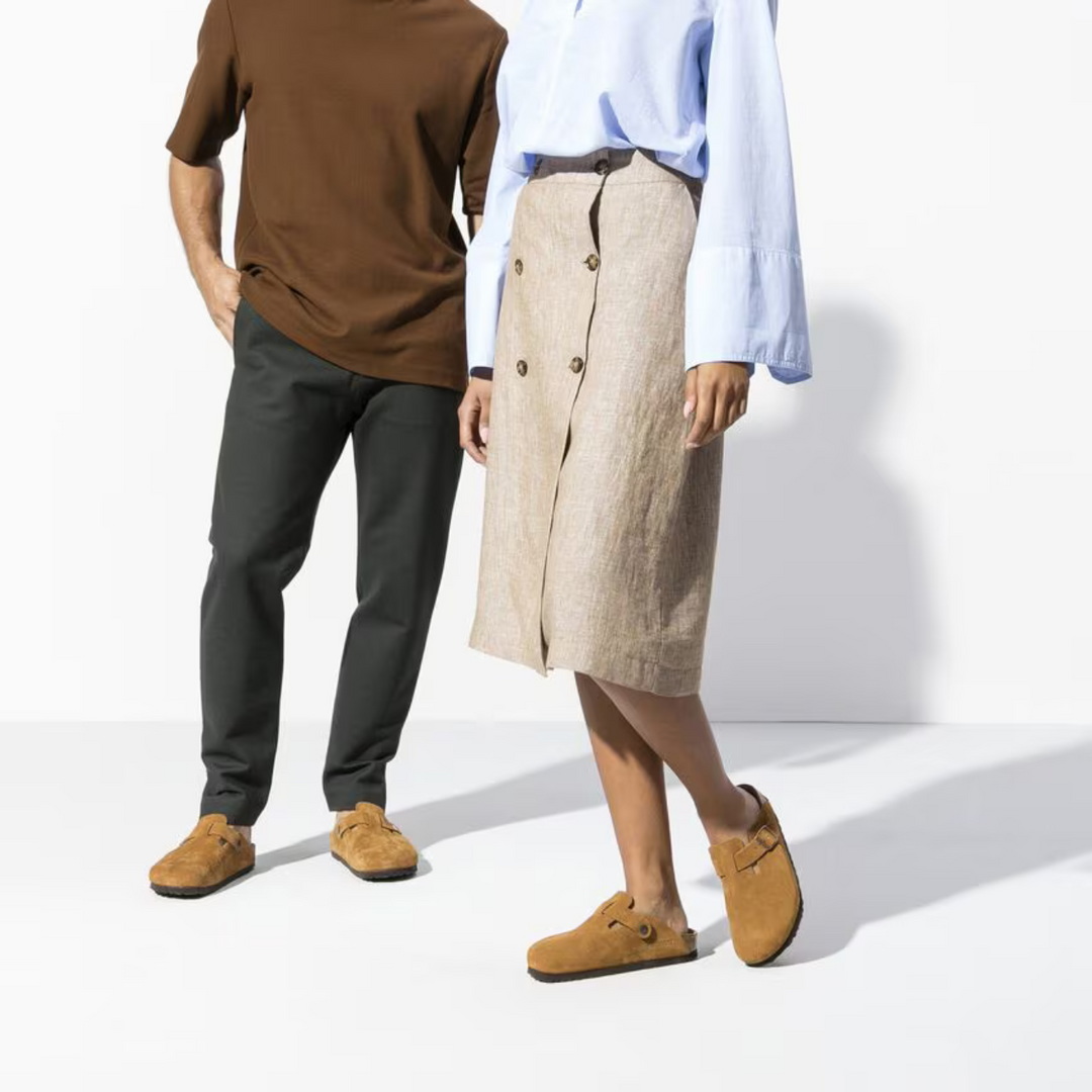 Pair of comfortable taupe Women's Boston clogs with cushioned footbeds, ready for casual slip-on wear.