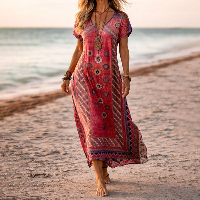 Bohemian women's flowy maxi dress featuring a vibrant botanical floral print and flattering V-neck design.