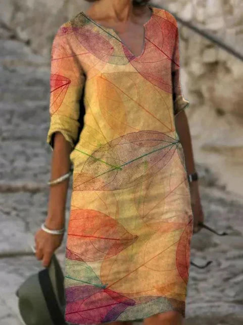 Women's comfortable V-neck midi dress with beautiful botanical print & functional pockets. Effortless style.