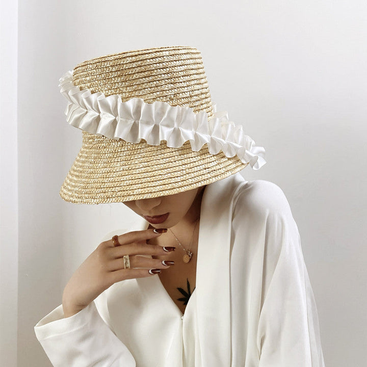 Striped braided straw sun hat for women, a stylish summer and beach essential