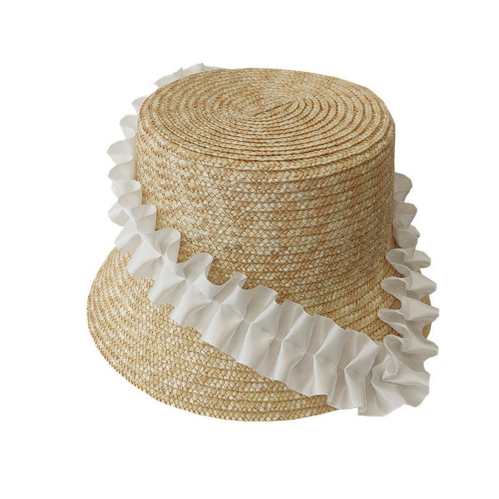 Stylish women's striped straw bucket hat, a key accessory for summer and vacations