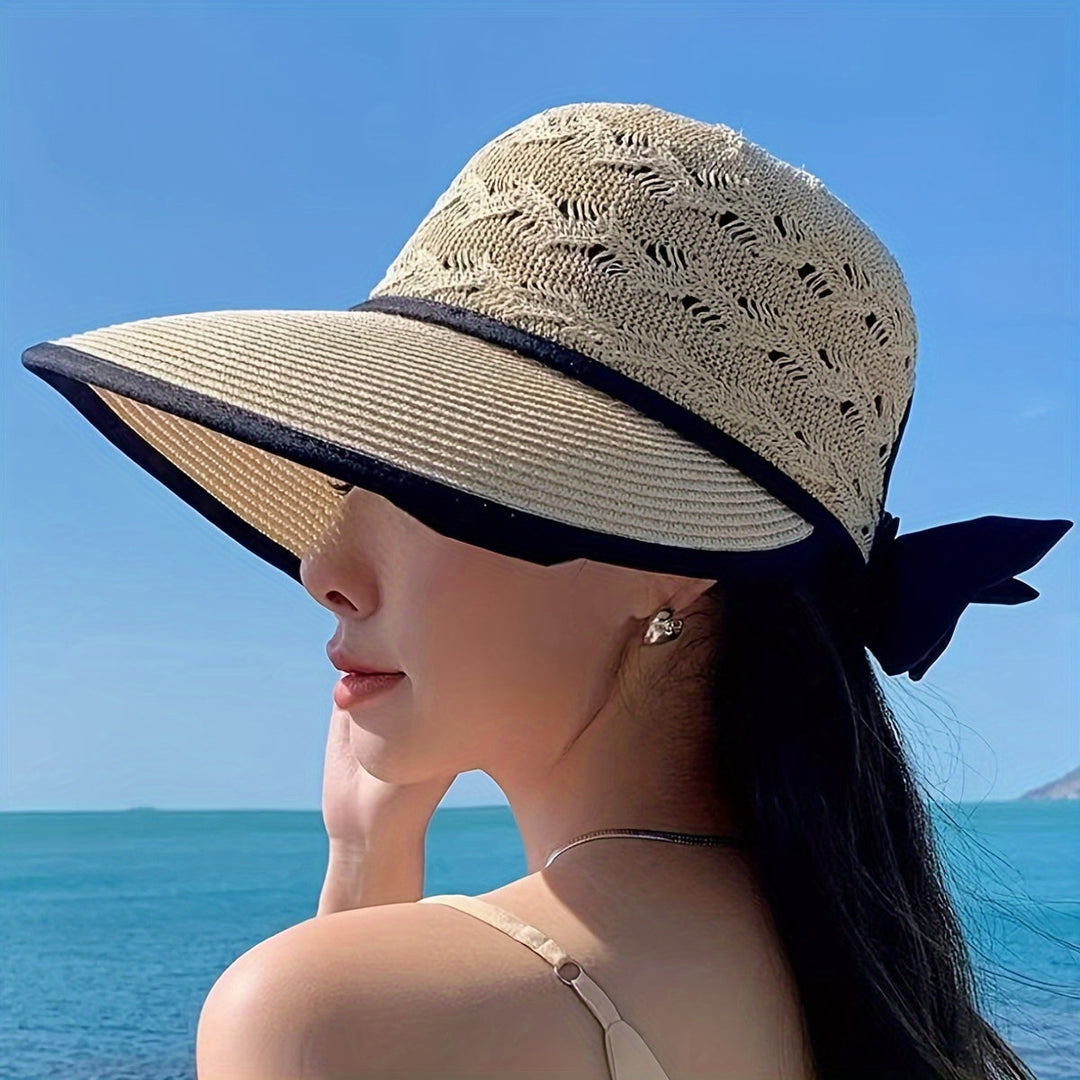 Women's braided summer hat with elegant bow detail, perfect for sun protection and beach fashion.