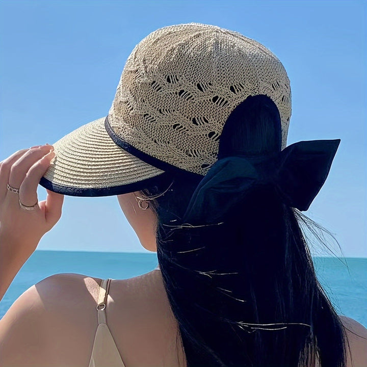 Stylish women's braided sun hat featuring a lovely bow detail, enhancing any summer wardrobe.