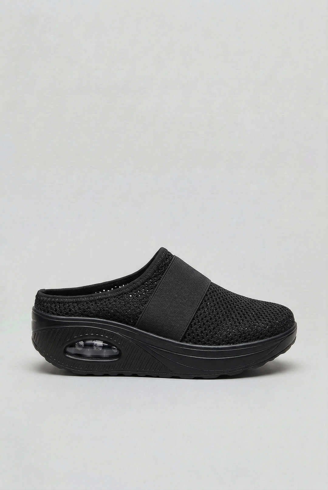 Pair of women's comfort mules with air cushion soles, ideal for breathable, lightweight summer wear.