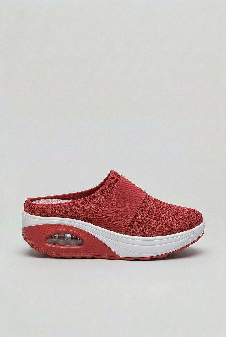 Detail of the air cushion sole on women's comfort mules, showing flexibility and shock-absorbing design.