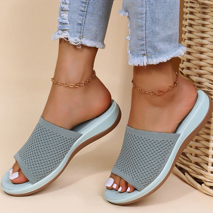 Stylish women's breathable slippers providing orthopedic support and all-day cushioned comfort.