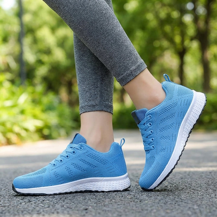 Women's breathable knitted sports shoes in a neutral color, active lifestyle