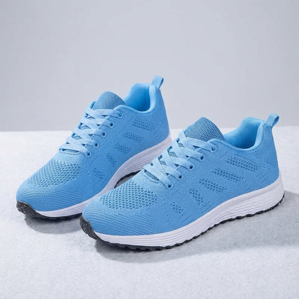 Close-up of knitted texture on women's sports shoes, emphasizing breathability