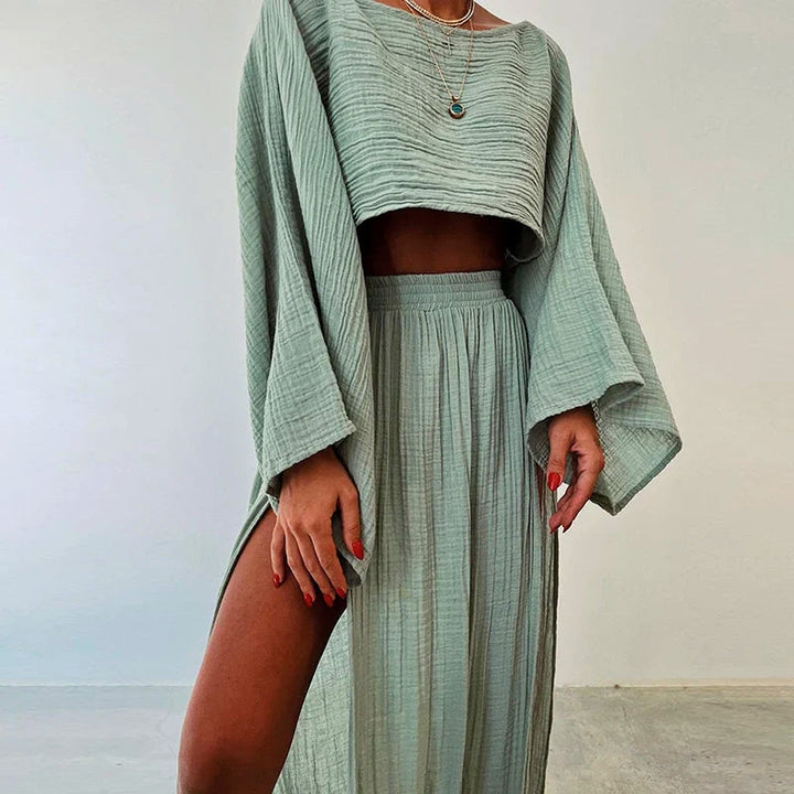 Women's breathable linen two-piece skirt set with cropped top & slit skirt, perfect for summer casual wear.