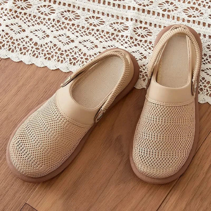 Comfortable women's mesh clogs, easy slip-on design for breathable summer wear and casual style.