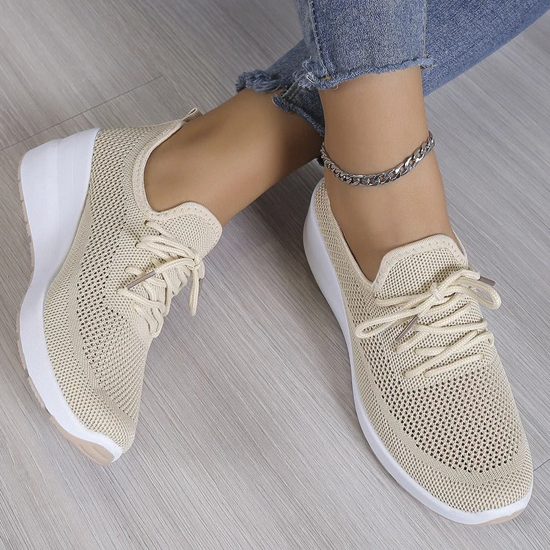 Stylish women's platform wedge sneakers. Breathable design ensures comfort for all-day wear. Fashion-forward casual shoes.