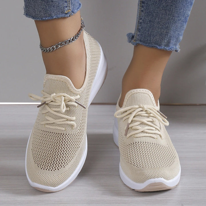 Comfortable women's wedge sneakers with a platform sole. Ideal for casual wear, offering an elevated look and breathability.