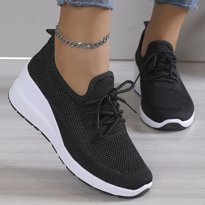 Fashionable women's platform wedge sneakers. Breathable, lightweight design for ultimate comfort and athletic casual style.