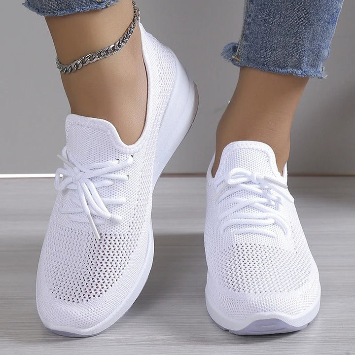 Breathable women's platform wedge sneakers. Comfortable, lightweight design for stylish casual outfits & all-day support.