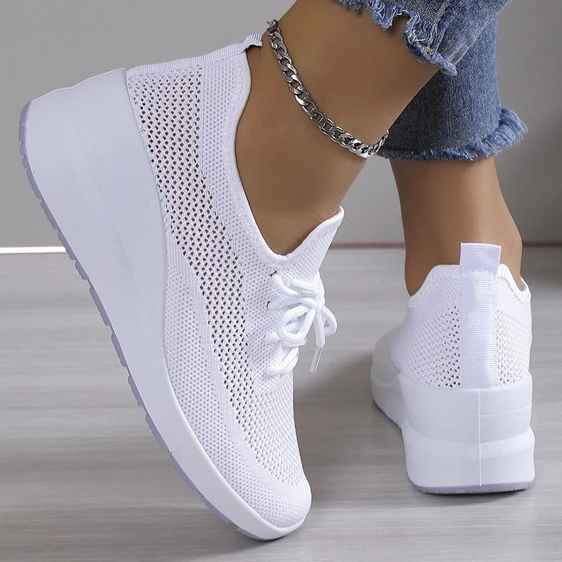 Women's comfortable platform wedge sneakers. Breathable material, elevated style, perfect for fashionable casual wear.