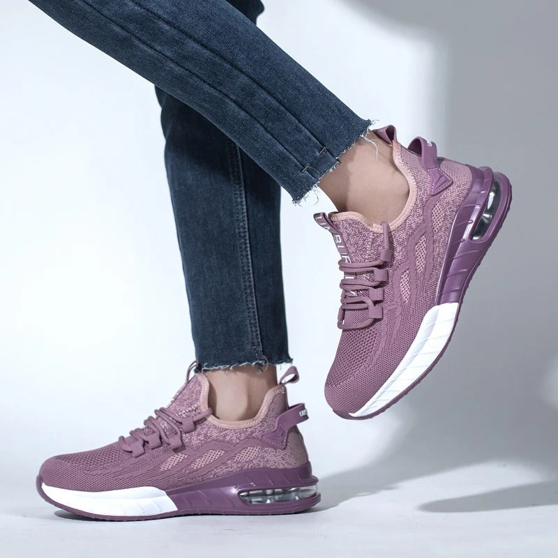 Protective women's steel toe work shoes, highly breathable for comfort, durable non-slip safety footwear.