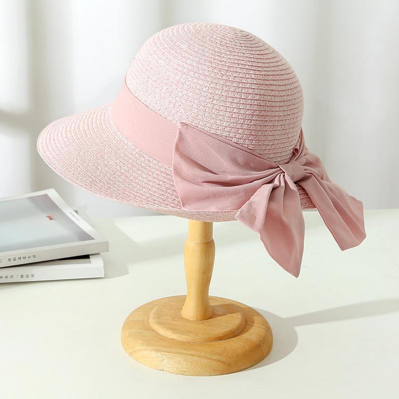 Breathable women's summer hat with a charming bow accent, a versatile accessory for any sunny outdoor activity.