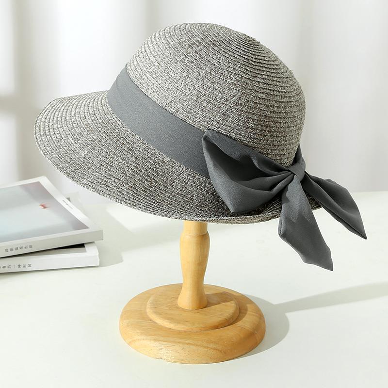Chic women's sun hat, Monica style, featuring a lovely bow and breathable material, perfect for summer outings.
