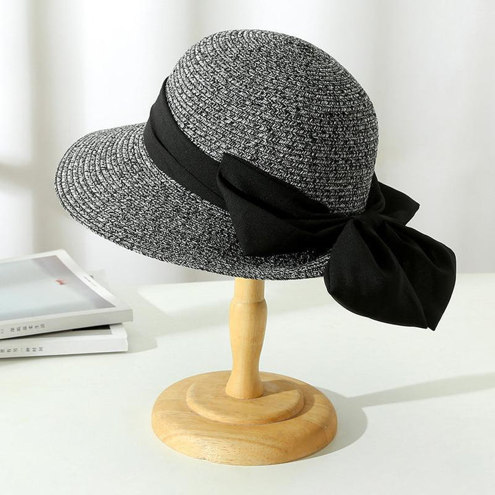 Fashion-forward women's breathable sun hat with a delicate bow, providing stylish protection for sunny days.