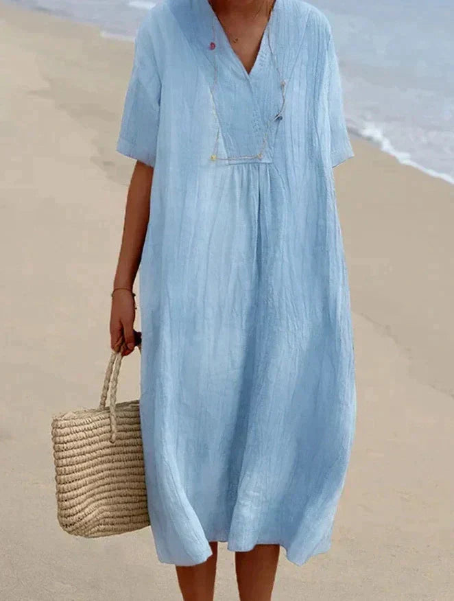 Women's breezy A-line summer dress with a flattering V-neck and practical side pockets, perfect for casual wear.
