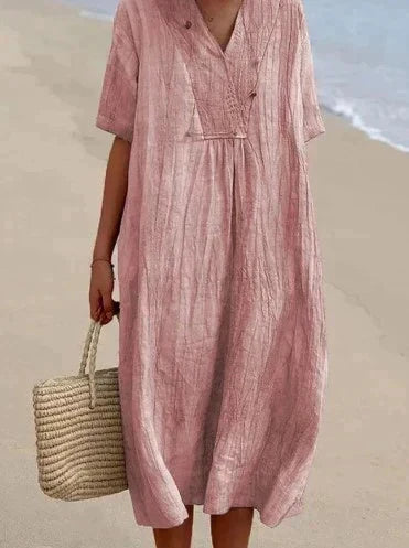 Effortlessly chic women's A-line summer dress, featuring a V-neck and functional pockets for daily comfort.
