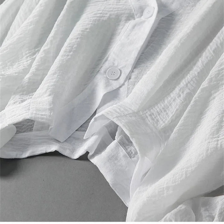 Stylish women's breezy blouse with voluminous balloon sleeves. Effortless and elegant for any warm weather occasion.