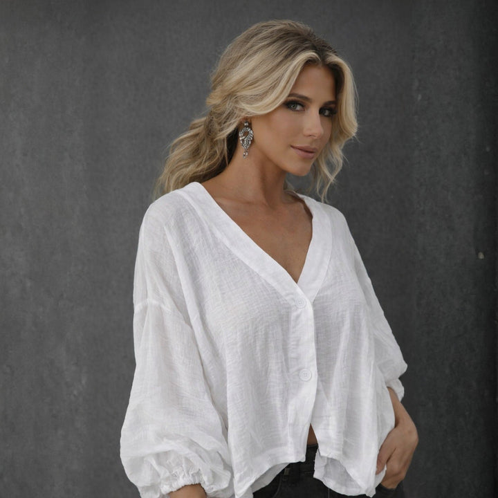 White women's loose fit batwing top, ideal for relaxed summer wear and everyday comfort.