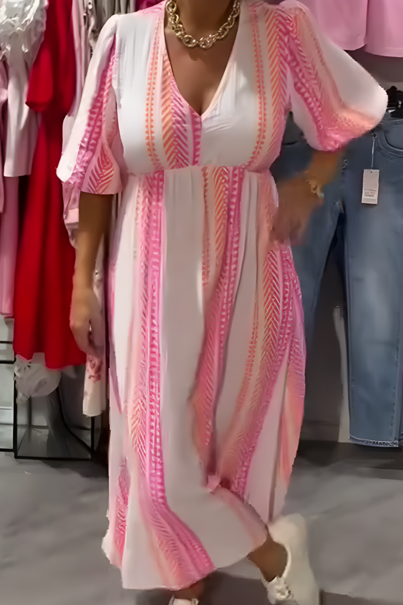 Women's breezy day dress with floral print, flutter sleeves, & V-neck. Perfect casual summer midi dress.