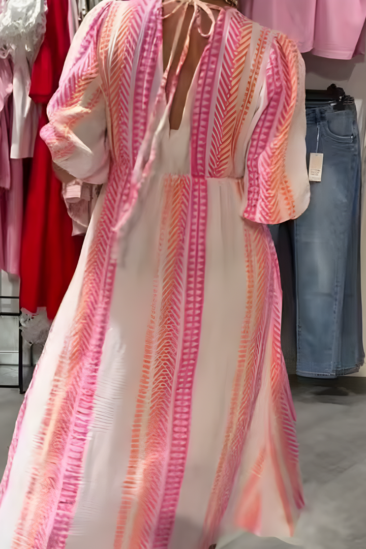 Women's casual day dress. Breezy summer midi with floral print, flutter sleeve, V-neck. Comfortable vacation style.