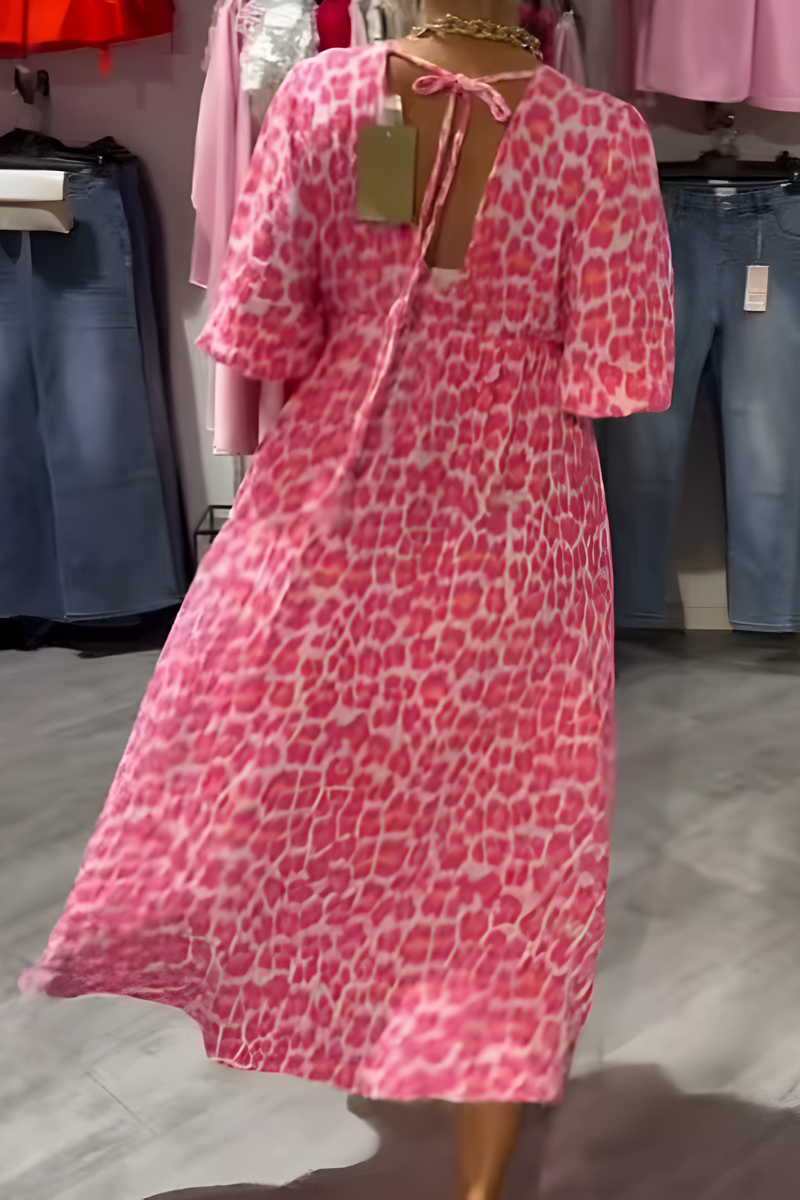 V-neck women's midi day dress with delicate floral print and airy flutter sleeves for a breezy summer look.
