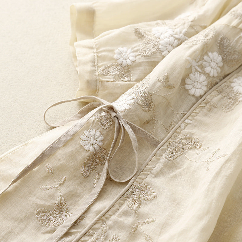 Elegant women's embroidered floral blouse, a long-sleeve tie-front casual top ideal for breezy spring & summer wear.