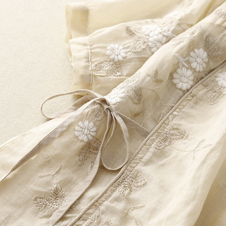 Elegant women's embroidered floral blouse, a long-sleeve tie-front casual top ideal for breezy spring & summer wear.