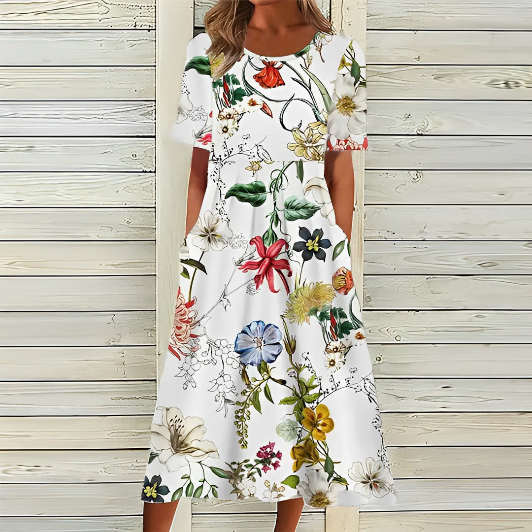 Women's breezy floral midi dress with short sleeves, perfect for elegant summer style or vacation.