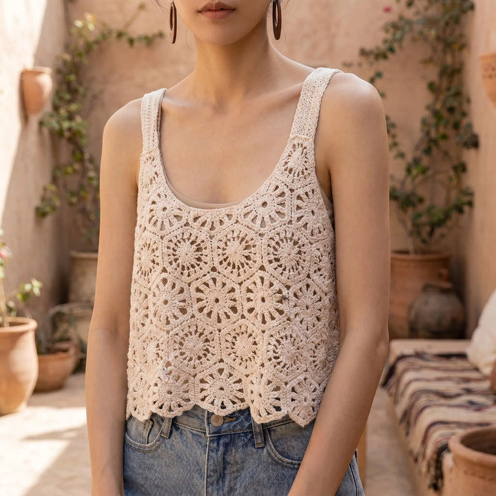 Women's breezy open-knit sleeveless crop top, perfect for summer casual wear.