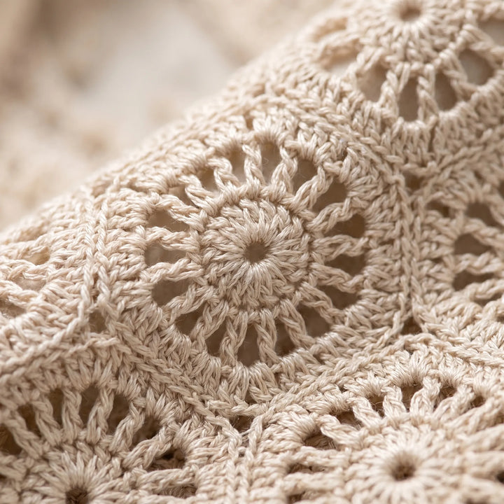Women's sleeveless crop top with a geometric open-knit pattern, lightweight and breezy for summer.