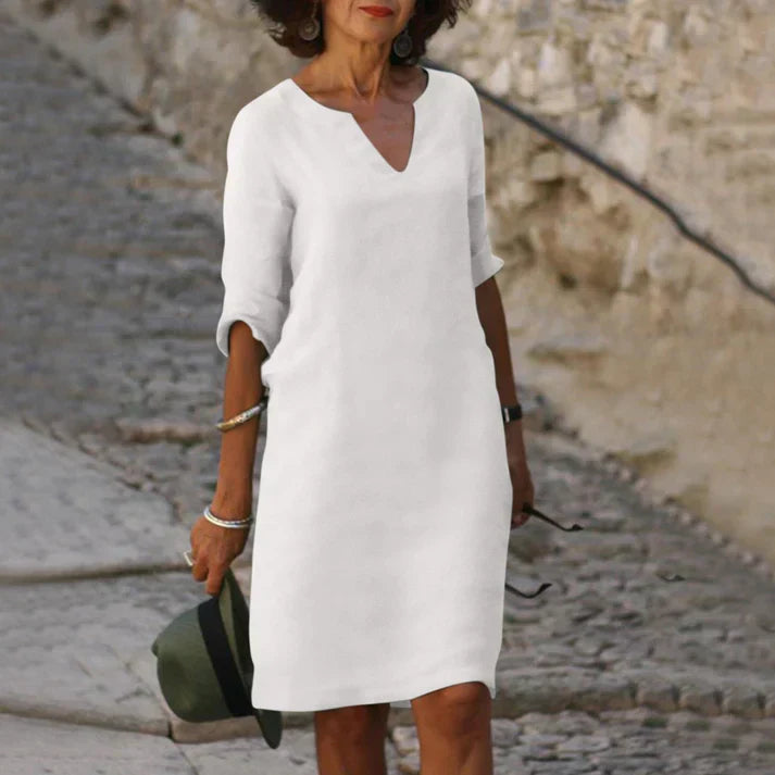 Casual flowy midi dress with V-neck, offering relaxed fit and ultimate summer comfort.