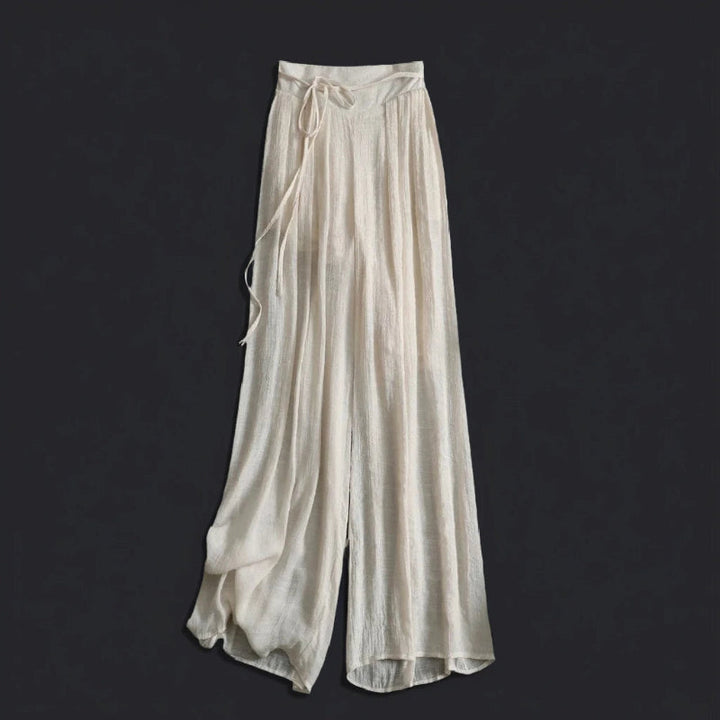 Flowy women's wide-leg summer trousers, ideal for beach, vacation, or relaxed elegant style.