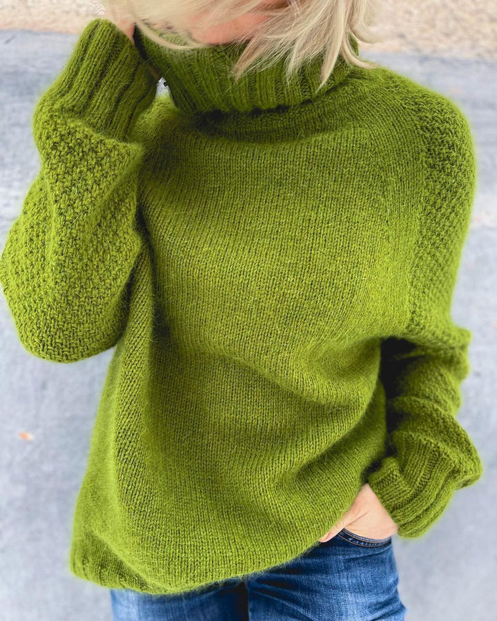 Vibrant bright green oversized sweater with a soft knit and cozy turtleneck for women.