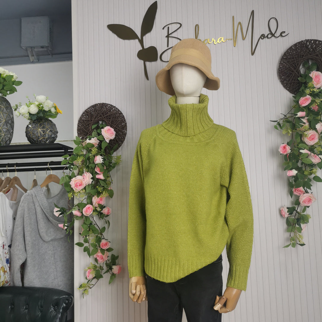 Cozy bright green long sleeve oversized sweater for women, featuring a warm knitted turtleneck.