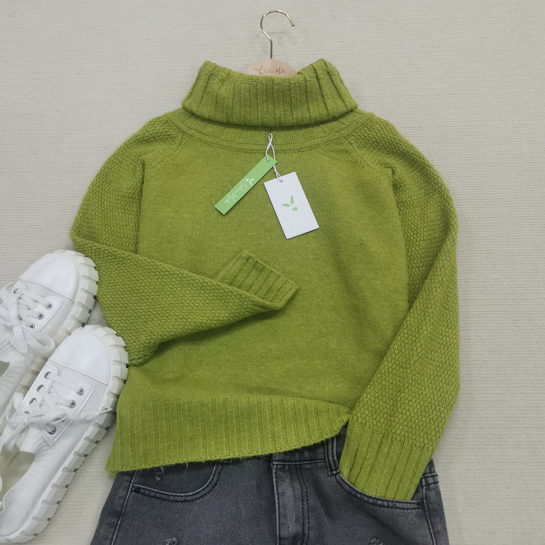 Women's vibrant green oversized sweater with a comfy knit and elegant turtleneck design.