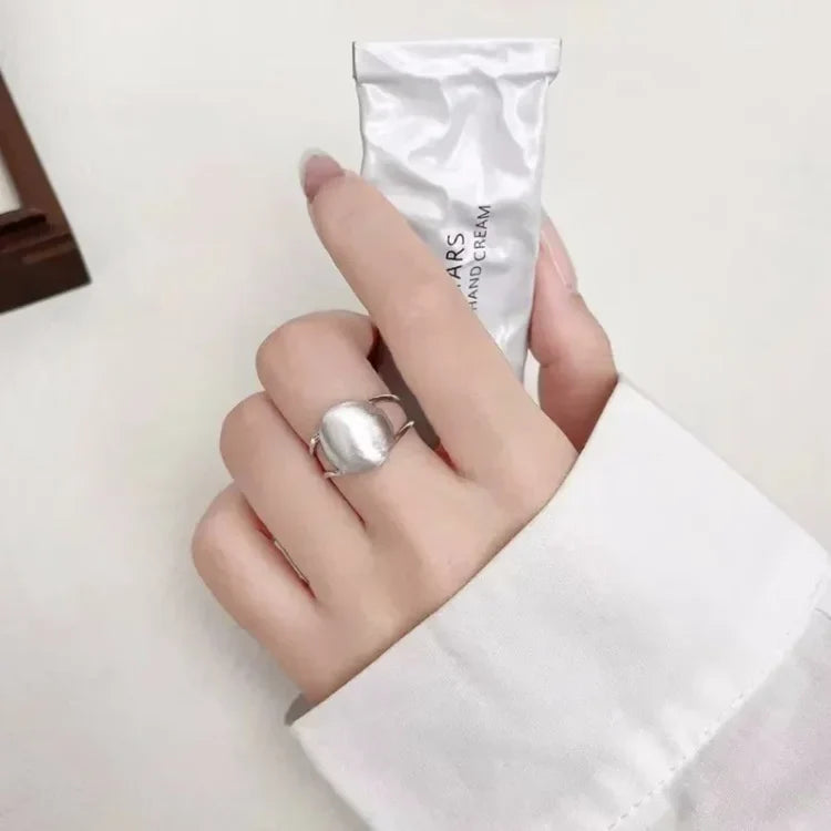 Elegant women's fashion ring: sterling silver half dome with a chic brushed finish. Modern minimalist jewelry.