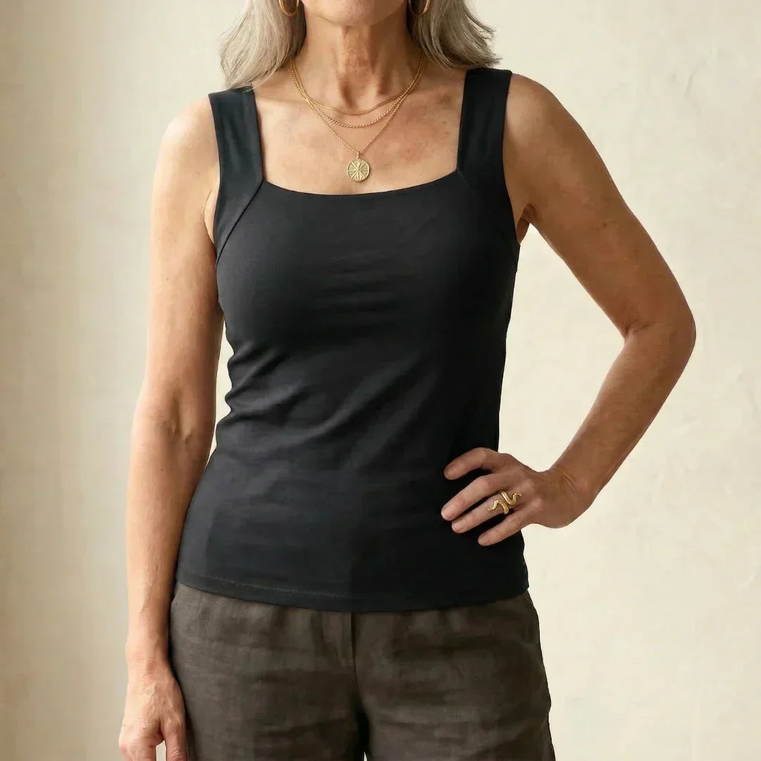 Core support women's tank top with built-in bra for a secure and comfortable fit.