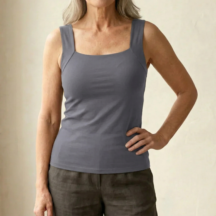 Seamless feel women's tank top with built-in bra, offering smooth, comfortable support.